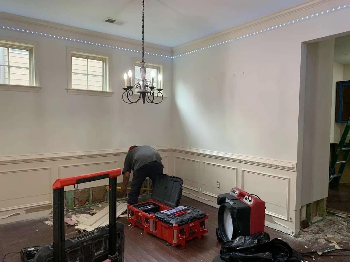 Restoration technician with professional equipment in Amityville
